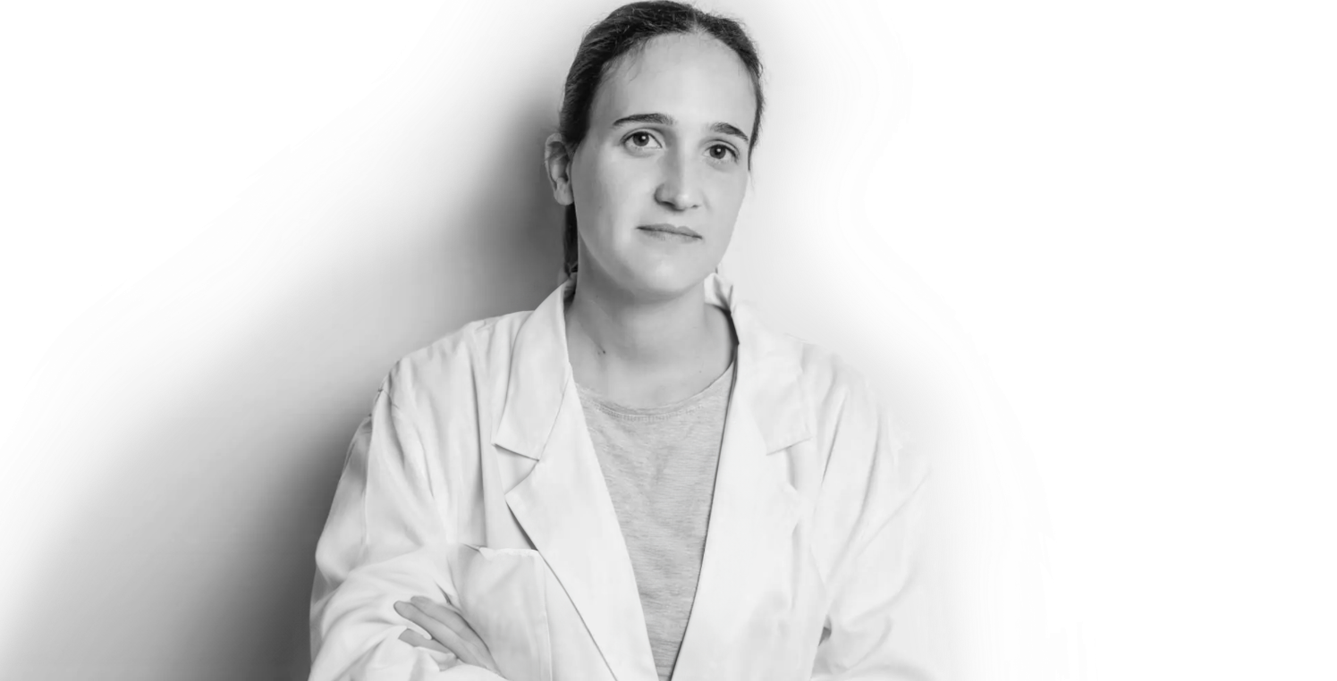 A healthcare professional wearing a lab coat.